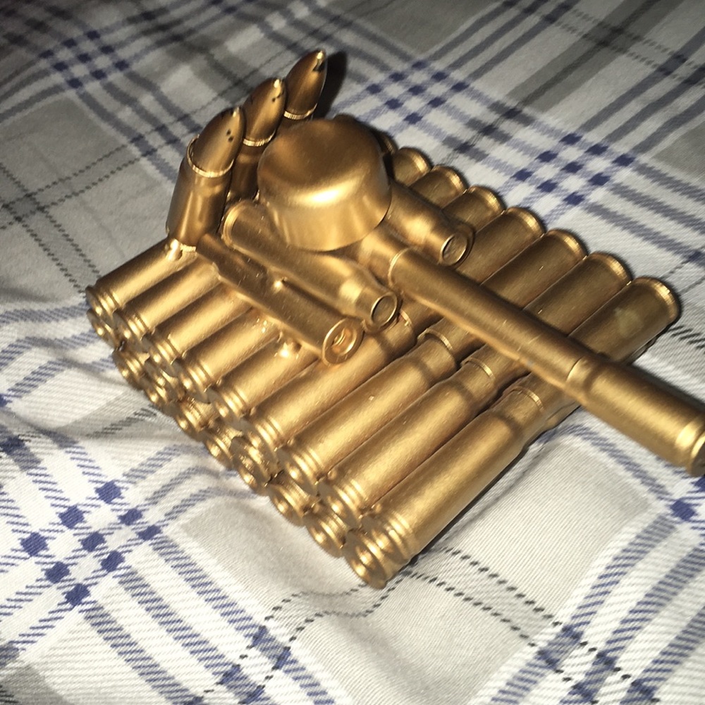 Metal tank with gold over the tank